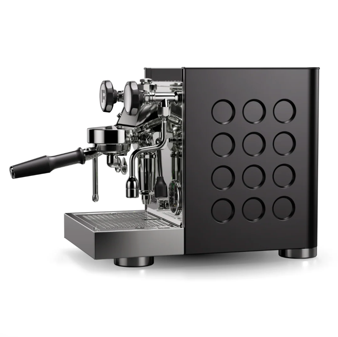 Rocket Appartamento TCA black espresso machine side view with circular cutout design - Rocket Appartamento TCA Black – Side View Compact Espresso Machine - Bold black finish with Rocket’s signature circular cutouts – compact Italian espresso redefined.